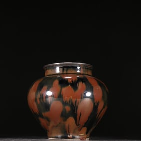 A silver jar wrapped in a Jizhou kiln