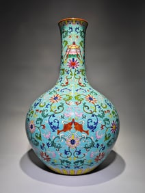 A Qianlong era of the Qing Dynasty enamel colored turquoise green lotus support eight treasure