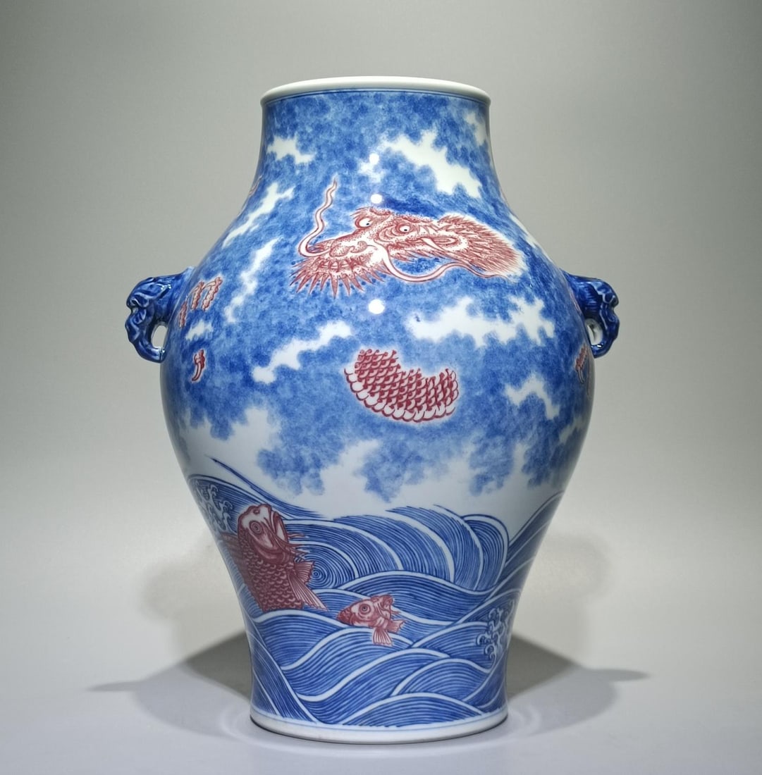 A blue and white glazed red fish leaping dragon gate amphora olive bottle: Qing Qianlong style blue and white glaze red fish leaping dragon gate amphora olive bottle SIZE: H:29.8cm W:22cm (The Dimensions Of All Batches Are Manually Measured.If You Need More Detailed Informat
