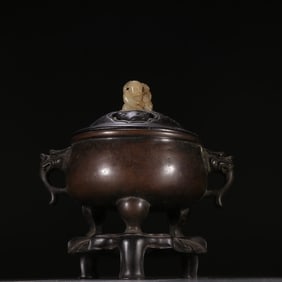 A Ming Dynasty copper tire three-legged aroma burner