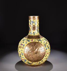 A Qing Qianlong yellow pastel consecrated carved gilt dragon and phoenix pattern celestial sphere