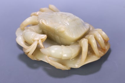 A Qing Dynasty Hetian jade eight directions come to wealth crab lotus leaf ornament
