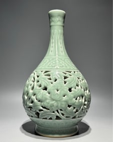 A Qing Qianlong model () bean celadon glaze hollow entwined lotus gall bottle