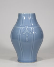 A Qing Qianlong era azure glaze carved with melon edge olive bottle