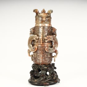 A Qing Dynasty Shoushan stone antique dragon pattern live ring ear bottle