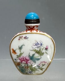 A Qing Dynasty Qianlong enamel flower snuff bottle