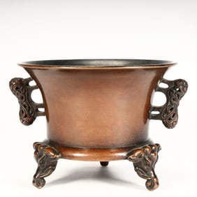 A Qing Dynasty copper hollow beast ear auspicious beast three-legged incense burner,