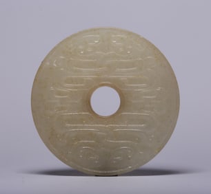 A treasured Hetian jade double dragon pendant