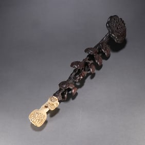 A rosewood ganoderma lucidum ruyi handle