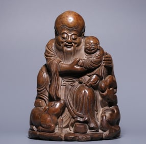 A Qing Dynasty bamboo carving boy birthday ornament