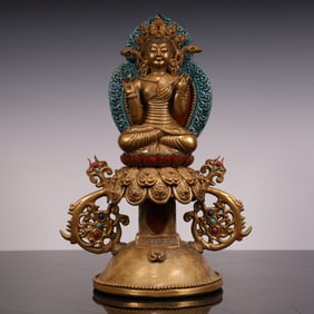 A Qing Dynasty porcelain gilt Buddha statue