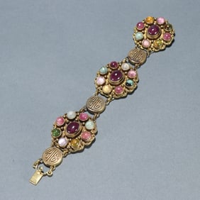 A reflux silver gilt inlaid multi-treasure bracelet