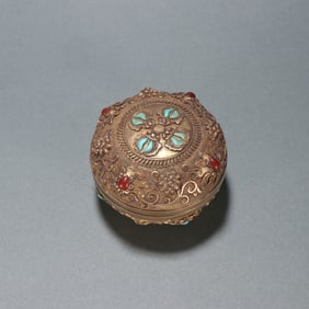 A copper-gilt turquoise patterned lid box