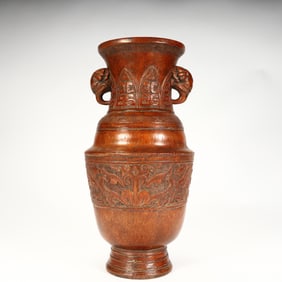 A Qing Dynasty bamboo carved animal ear gluttonous pattern bottle