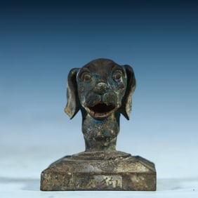A Tang Dynasty copper painted dog head seal
