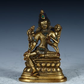 A Qing Dynasty copper-gilt green Tara Buddha statue