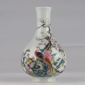A Qing Dynasty Qianlong enamel flower and bird poetry vase