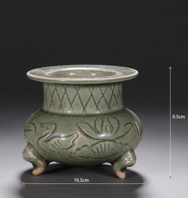 A Song Dynasty Longquan kiln carved three-legged furnace