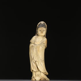 A wooden carved statue of Guanyin