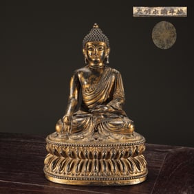 A seated statue of the Medicine Buddha in the Ming Dynasty with a bronze gilt fetus