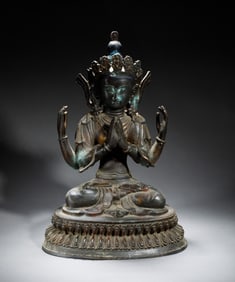 A piece of copper four-armed Guanyin