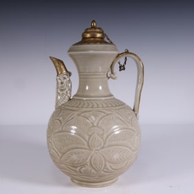 A celadon carved gilt pot