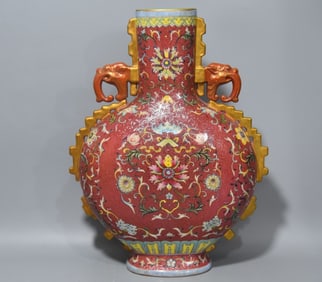 A carmine red amphora flower holding the moon bottle