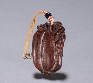 A Qing Dynasty agarwood blessing melon pendant