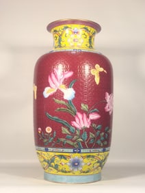 A Qing Dynasty Qianlong imperial enamel carmine red flower dongmelon bottle