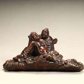 A piece of agarwood carving and two immortal ornaments