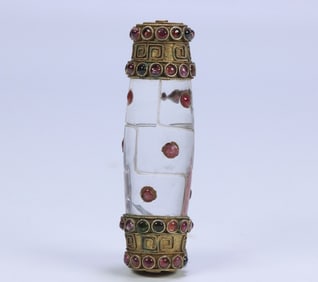 A Ming and Qing dynasty crystal panel with 9 eyes of Dzi covered with copper gilt at both ends