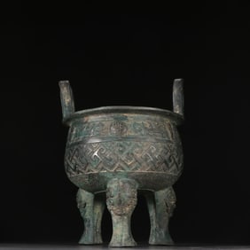 A bronze three-legged cauldron furnace
