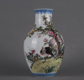 A Qing Dynasty Yongzheng enamel flower and bird poetry vase