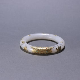 A Hetian jade-filled gold-filled bracelet