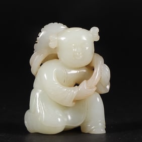 A piece of Hetian jade holding the lotus boy