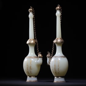 A Qing Dynasty sterling silver gilt inlaid white jade clean pot (a pair)