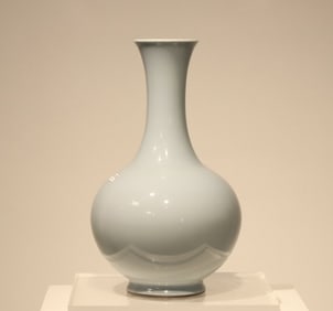 A Qing Dynasty Qianlong sky blue glaze skimming vase