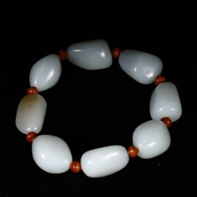 A white jade bracelet made of Hetian jade seed