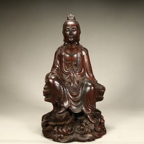A seated statue of Guanyin in agarwood in the Qing Dynasty