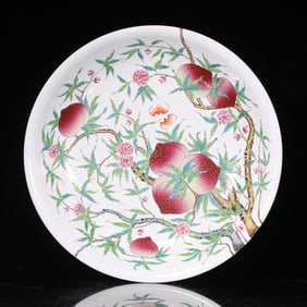 A Qing Dynasty Qianlong pastel longevity peach pattern plate