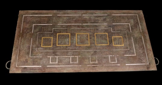 A Han Dynasty Cuo gold, silver and bronze plaque