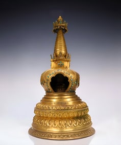 A Qing Dynasty copper gilt inlaid gemstone pagoda