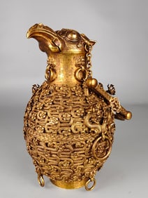 A Qing Dynasty copper-gilt bird bottle