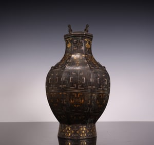 A Hancuo gold and silver hexagonal square bottle