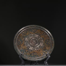 A Han bronze gold and silver beast pattern mirror