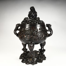 A three-legged aromatherapy stove with Qing Dynasty rosewood carved dragon pattern animal ears