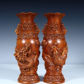 A pair of Qing Dynasty high-quality boxwood carved dragon and phoenix vases