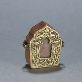 A black box with copper gilts