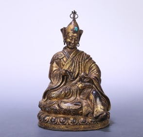A 17th-century Tibetan Buddhist bronze gilt statue of Master Lotus Peanuts