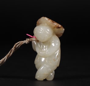 A Qing Dynasty Hetian jade seed material boy holding lotus